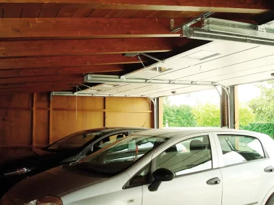 Lamellar wooden garage with tilting blind